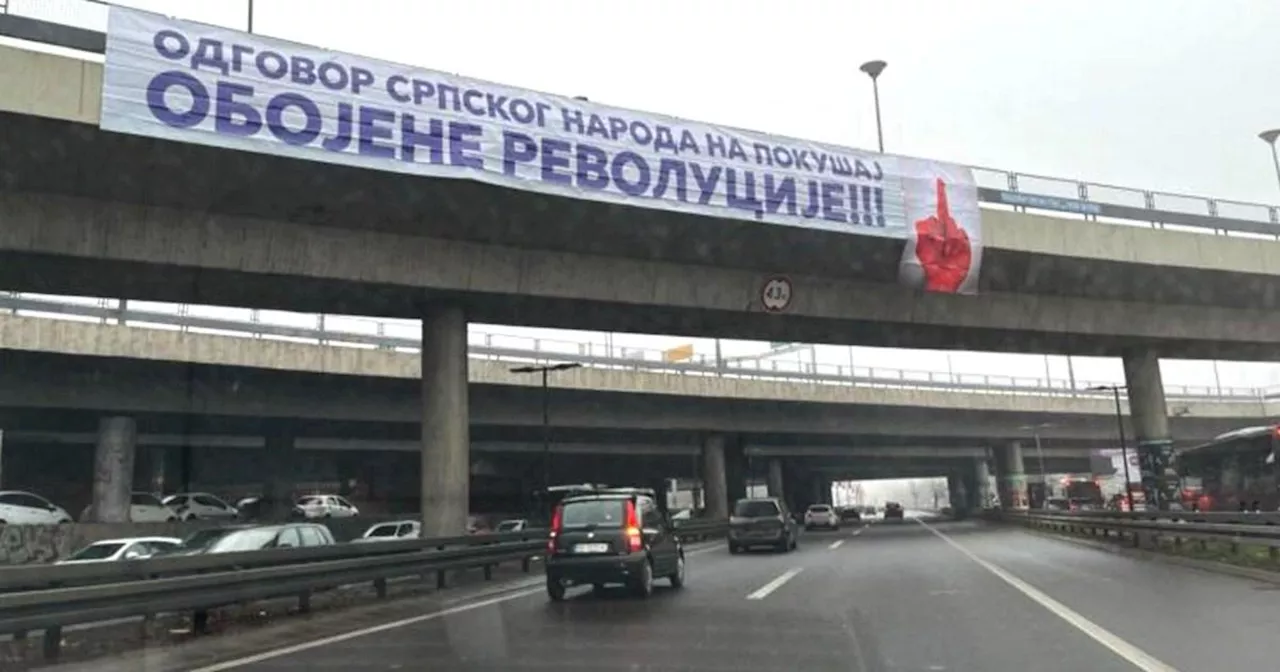 Serbian government seemingly responds to protests with bloody middle finger banners