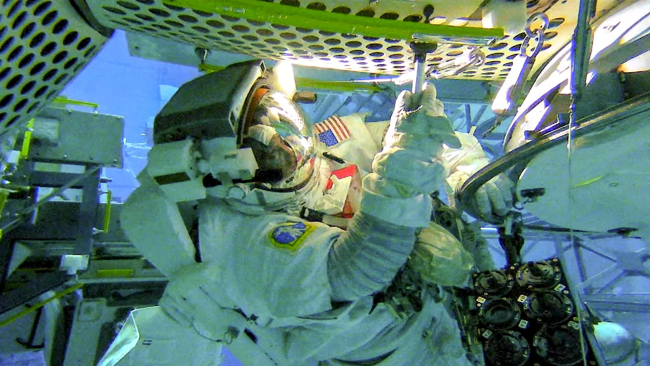 NASA Astronaut Tests Microorganism Collection Methods for External ISS Surfaces