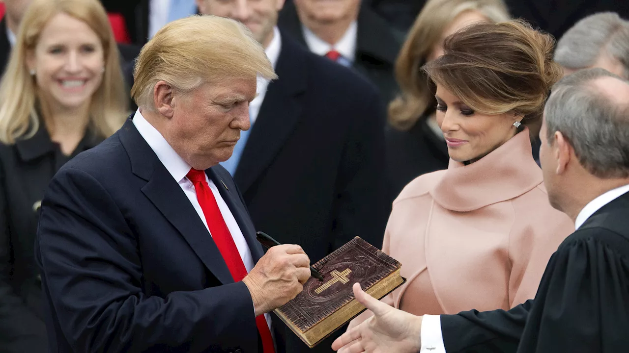 Trump Autographs Inaugural Bible Before Handing It Back to Roberts