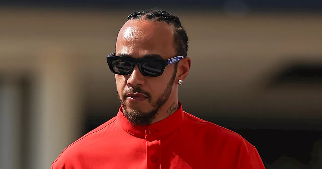 Lewis Hamilton Makes First Appearance in Ferrari Suit