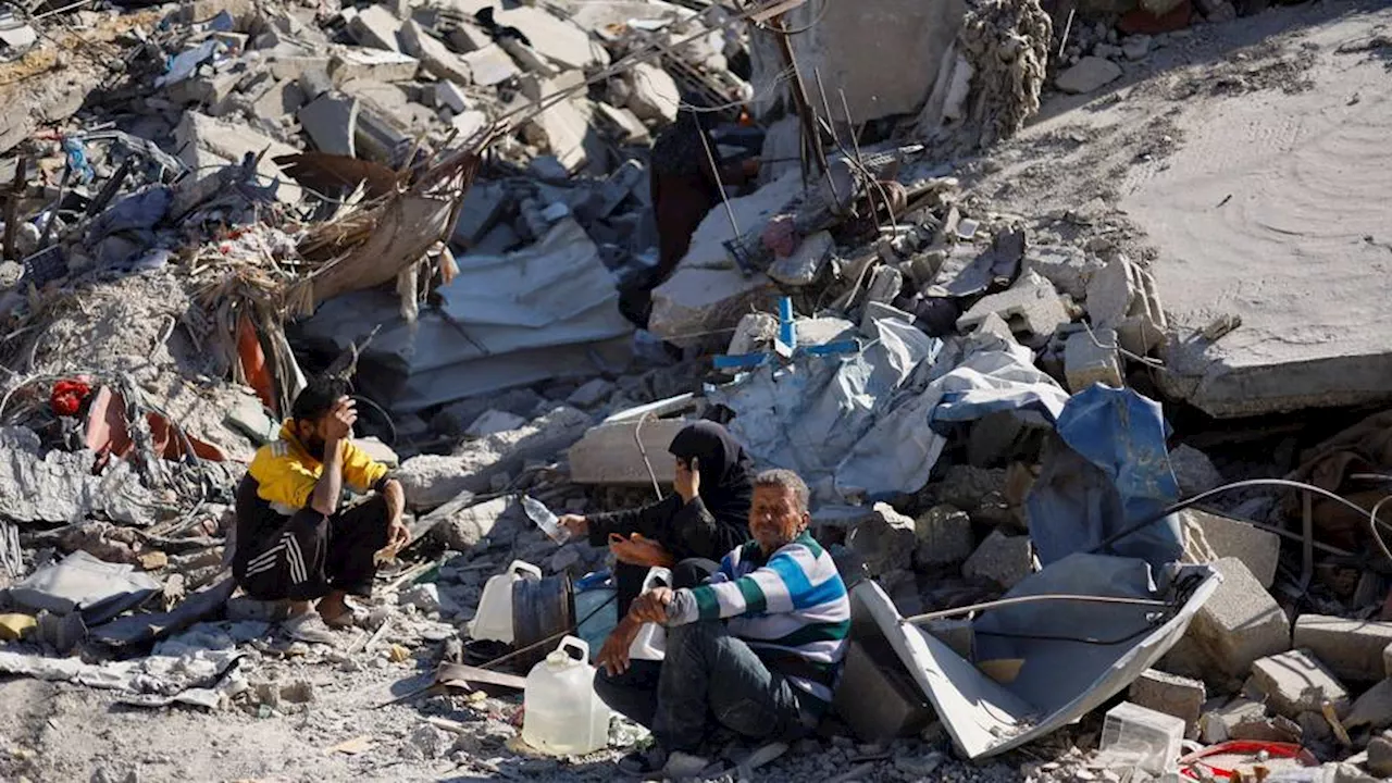 'All I want is grave for them': Palestinians in Gaza dig bodies from ruins