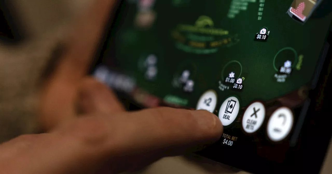 Casino App 'Deal' Button Shown in Photo Illustration