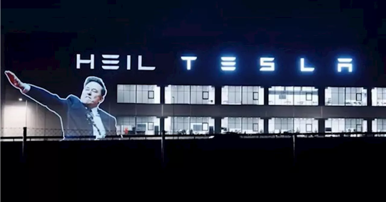 Elon Musk Projected on Tesla Gigafactory With Controversial Salute