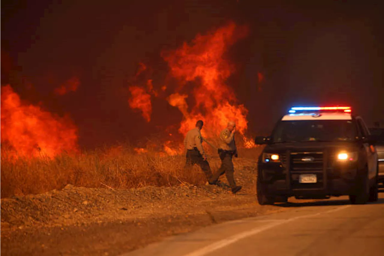 Firefighters battle to maintain the upper hand on a huge fire north of Los Angeles