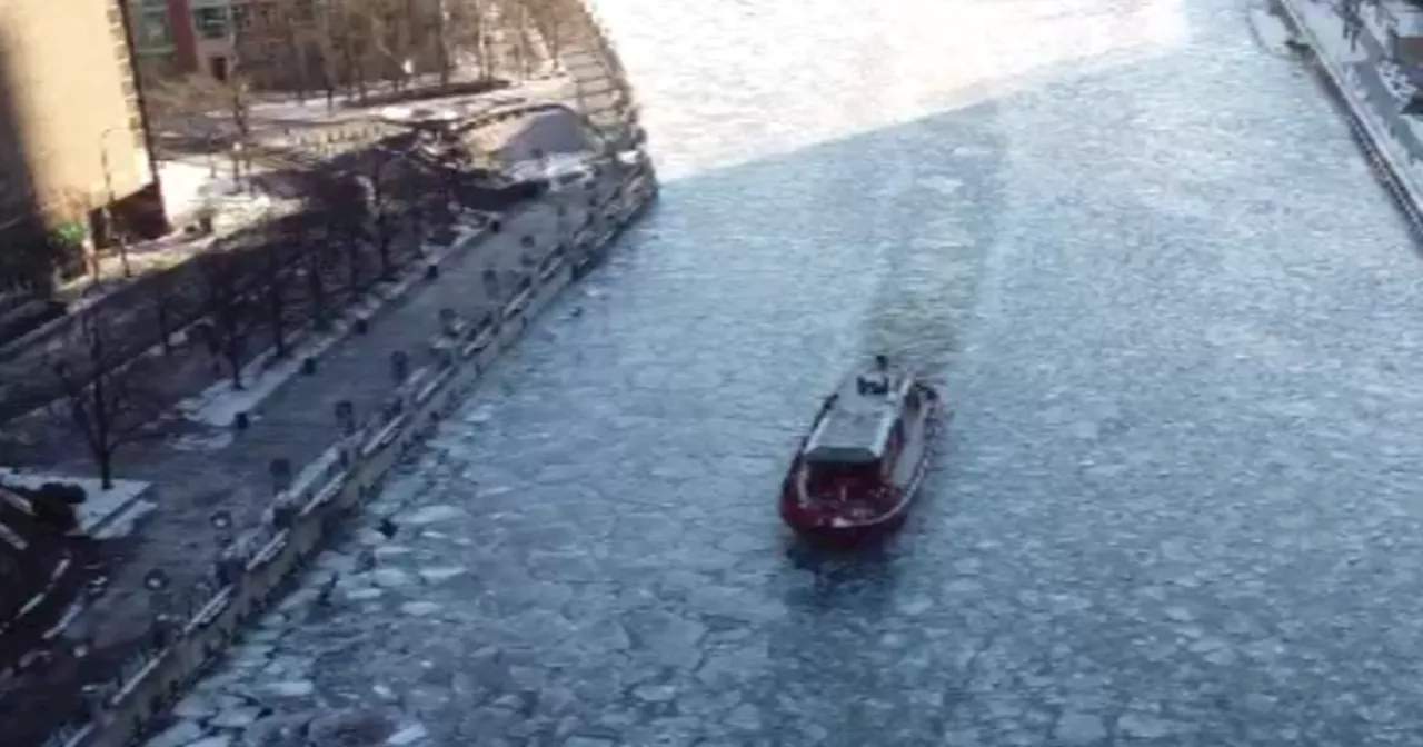 Chicago Firefighters Brave Cold to Keep the River Flowing