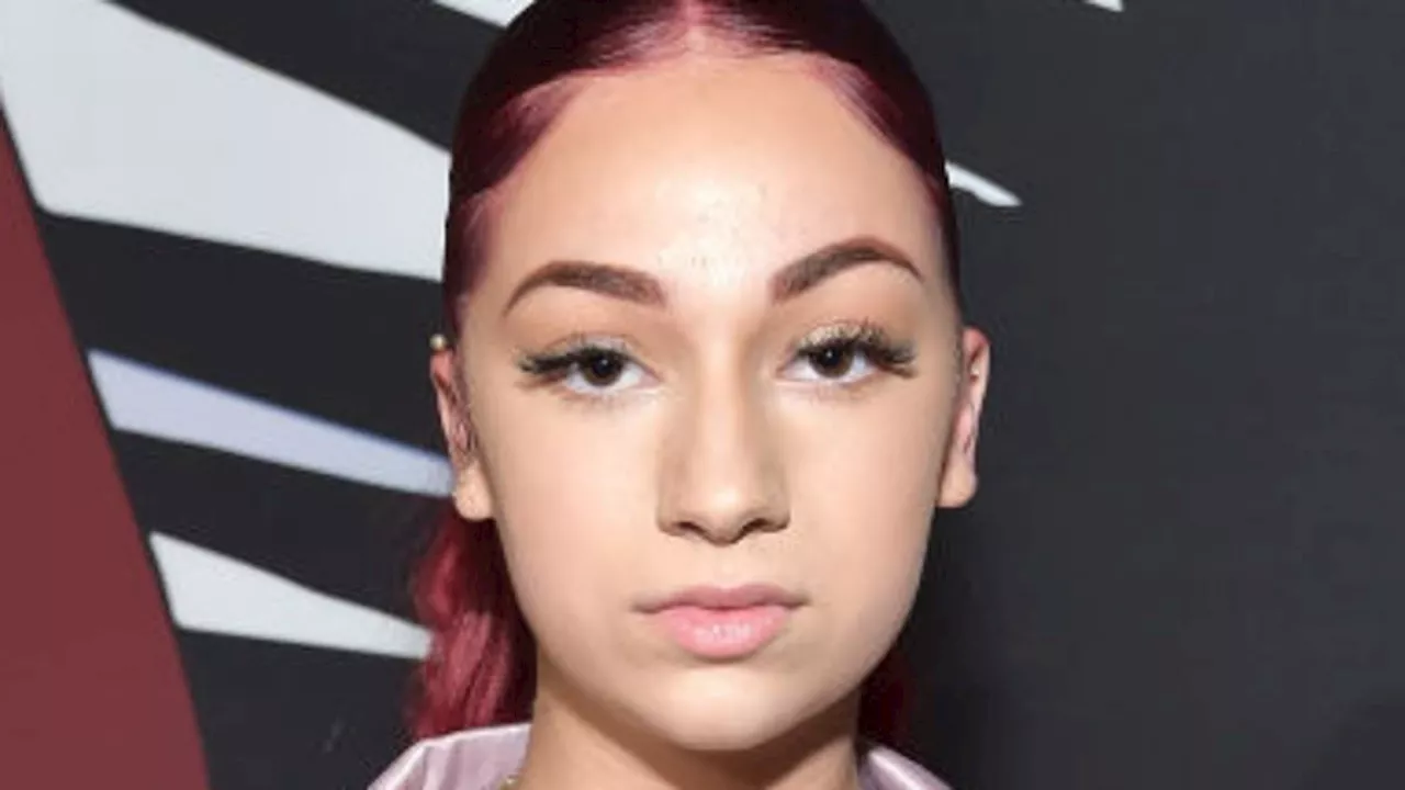 Bhad Bhabie poses with her luxury purse collection after getting nose job amid cancer battle