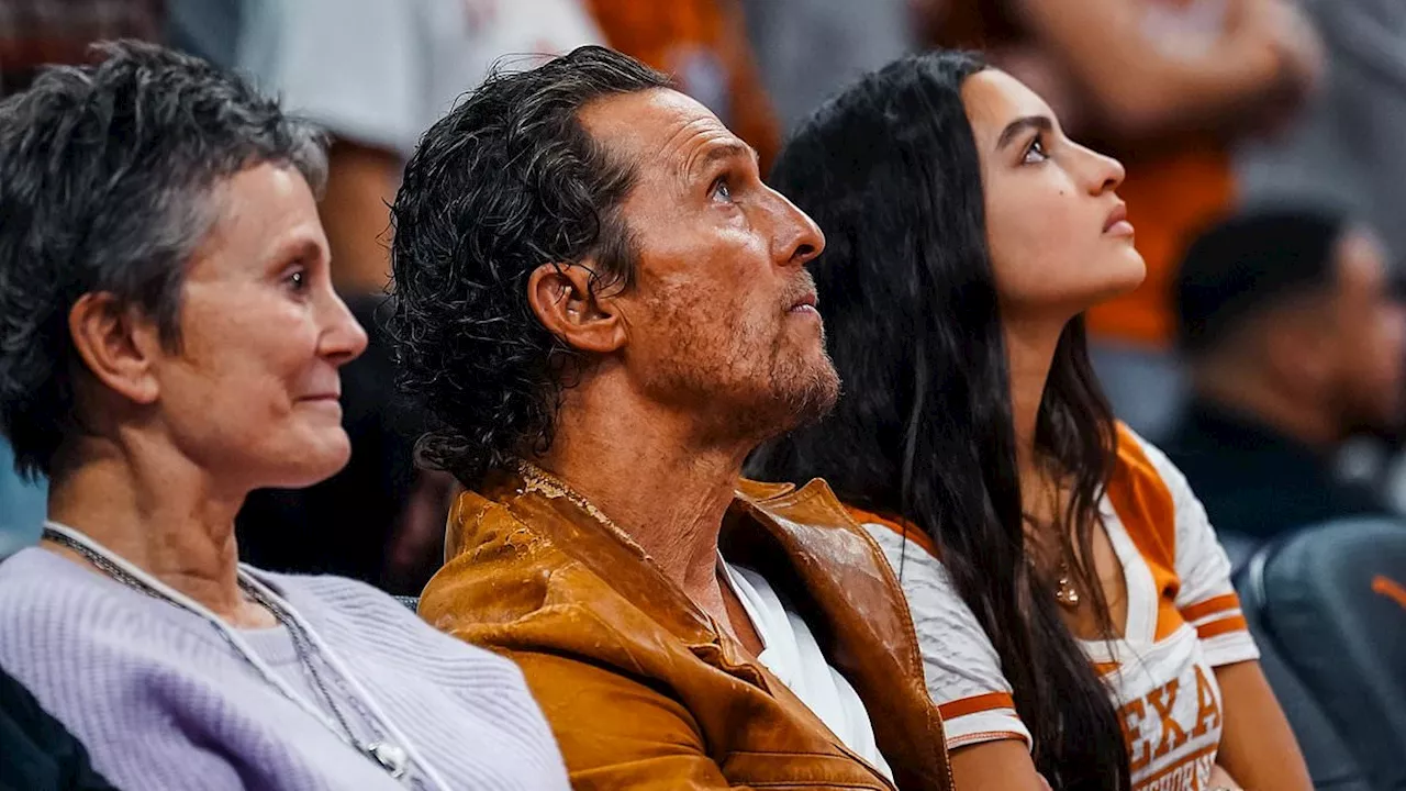 Matthew McConaughey enjoys quality time with daughter Vida, 15, at a UT women's basketball game...