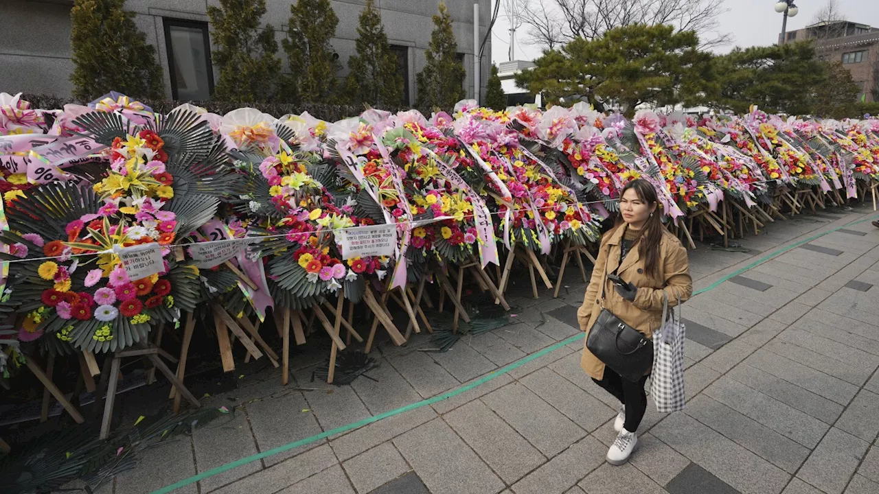 South Koreans turn funeral wreaths and K-pop light sticks into political protest tools