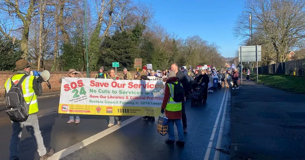 Dozens march down busy road in community centres and library protest