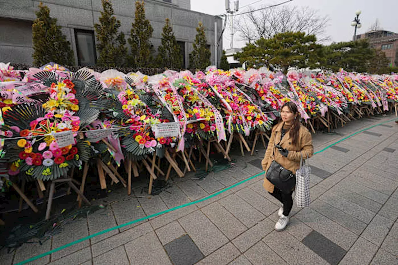 South Koreans turn funeral wreaths and K-pop light sticks into political protest tools