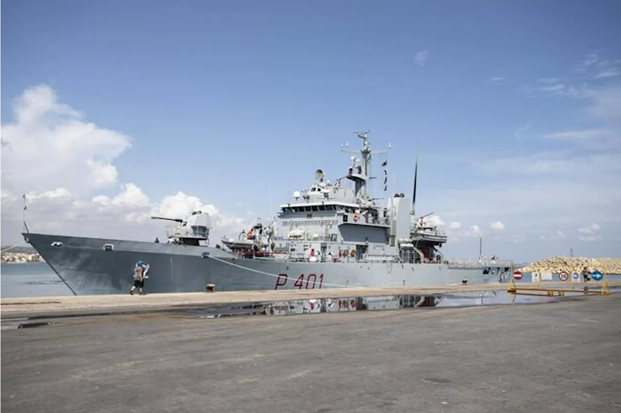 Italian Navy ship taking 49 migrants to Albania