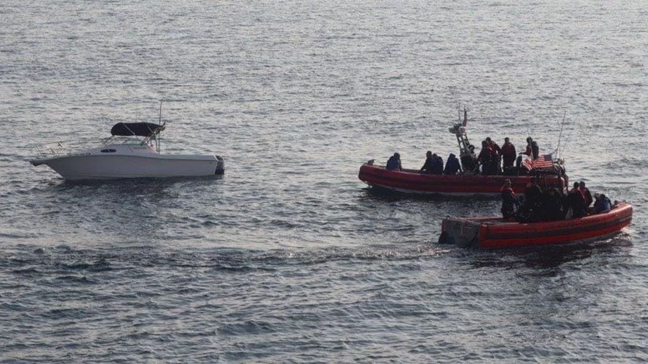 US Coast Guard Conducts 'Alien Expulsion' Operations, Intercepting Sinking Migrant Vessel