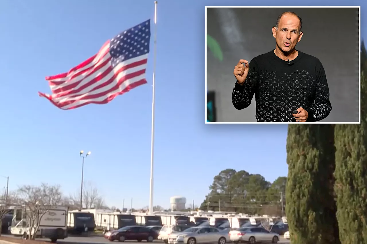 RV dealer racks up fines over giant American flag — but CEO and TV star says it's not coming down