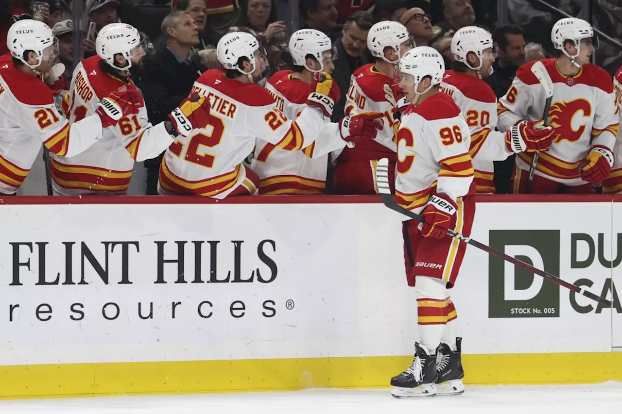 Kuzmenko scores twice, Flames beat Wild 5-4