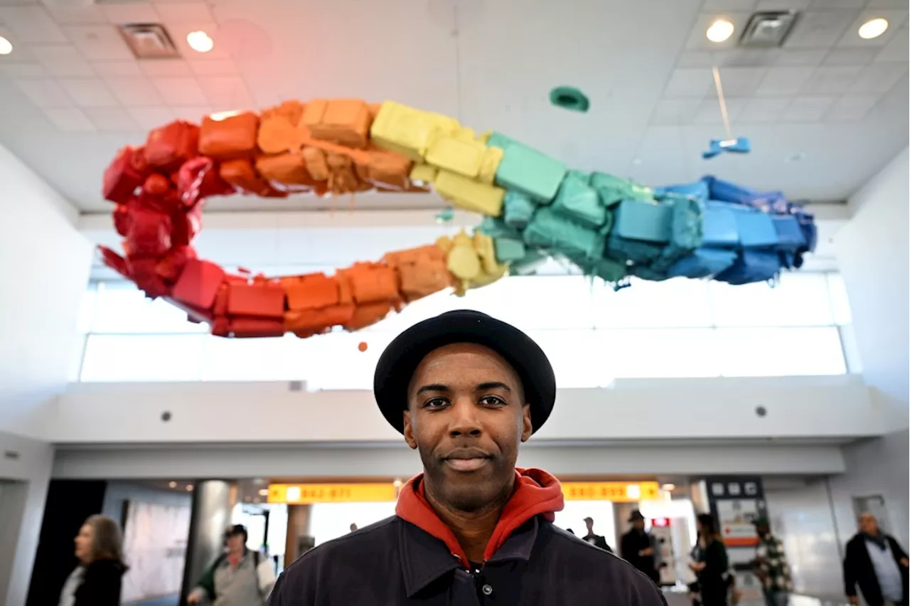 Artist 'Detour' Evans Unveils Luggage-Themed Sculpture at Denver International Airport