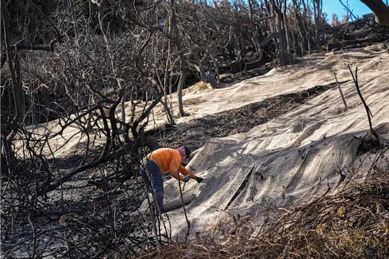 Rain in Southern California creates mudflows but helps firefighters