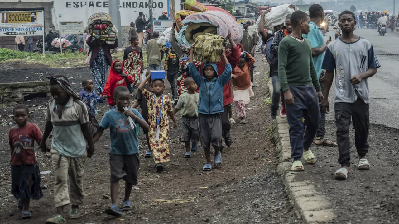 Thousands flee fighting in Congo as rebels claim they've captured the key city of Goma