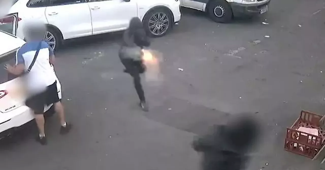 Shocking moment 'revenge attack' gunman opens fire in car park