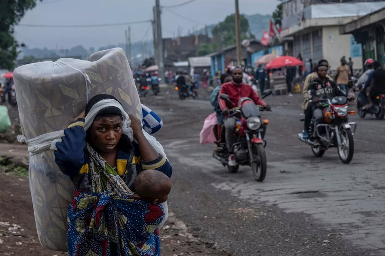 Thousands flee fighting in Congo as rebels claim they've captured the key city of Goma