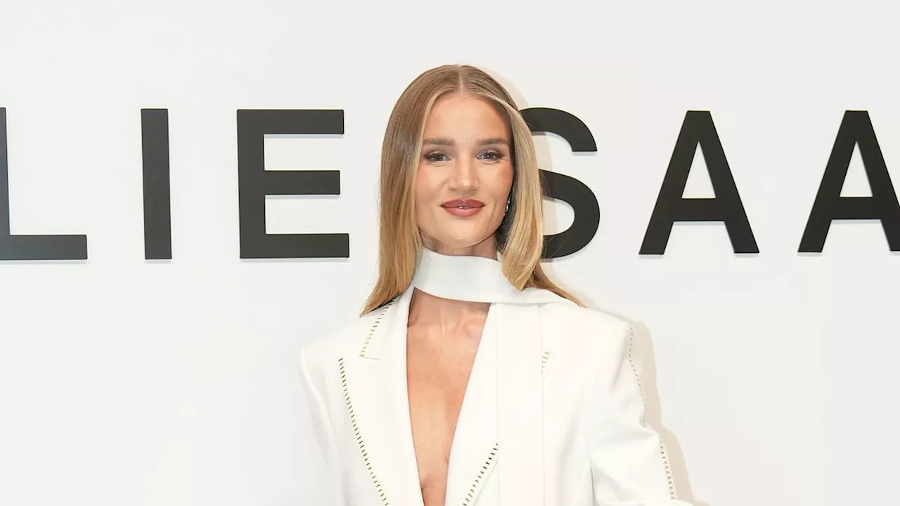 Rosie Huntington-Whiteley stuns in a plunging blazer while pregnant Poppy Delevingne opts for a chic...