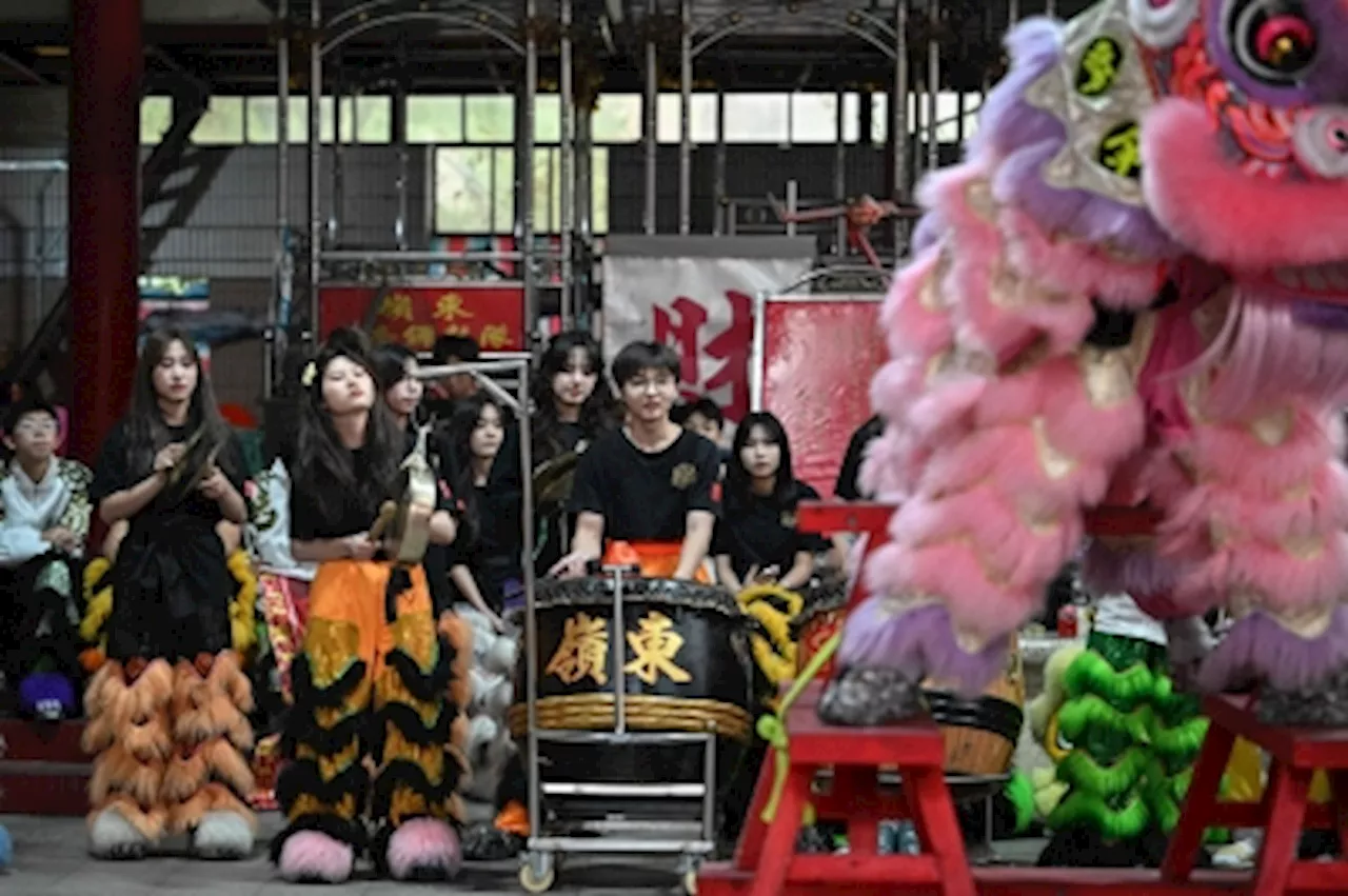 Slithering past stereotypes: Women slay China’s lion dance scene