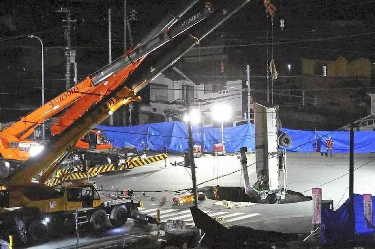 Rescue continues for truck driver trapped in Japan's Yashio sinkhole