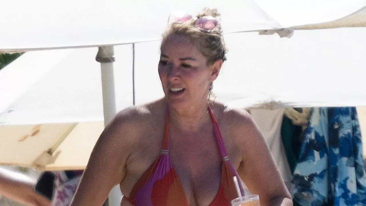 Carefree Claire Sweeney, 53, hits the beach in colourful bikini in sunny Barbados as she moves on...