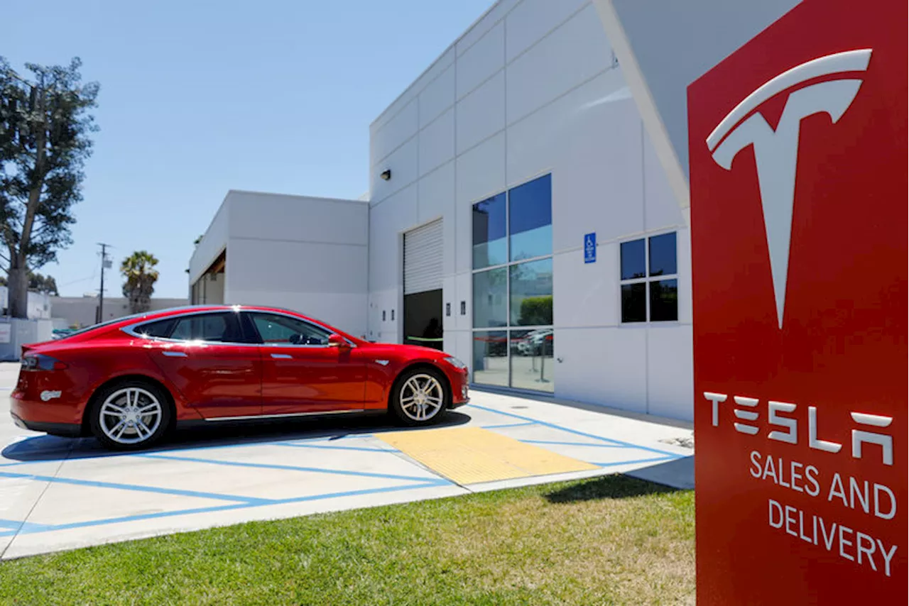 Tesla Reports First Yearly Drop in Deliveries as High Borrowing Costs Weigh on Demand