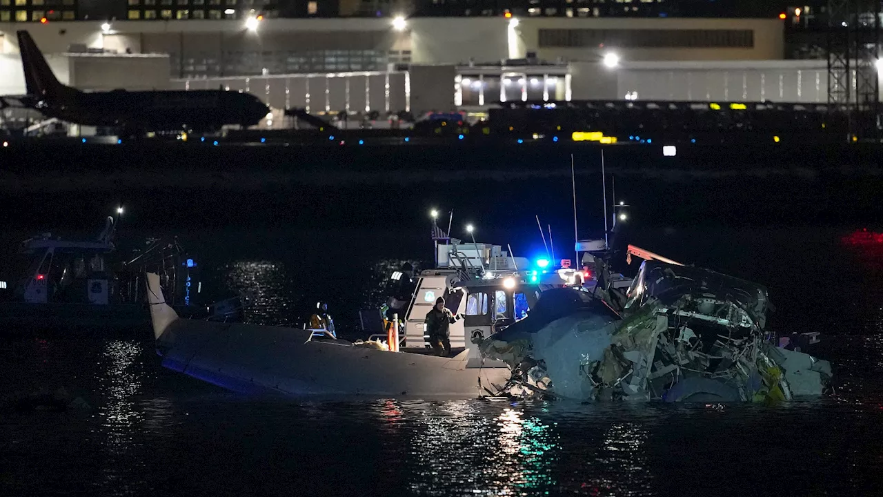 ‘At least 18 dead’ as American Airlines plane plunges into river & ‘splits in two’ after crash with helicop...