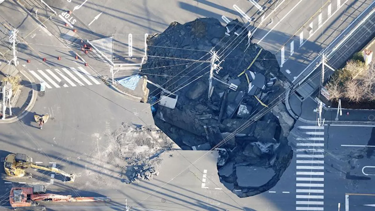 Sinkhole Devours Truck, Traps Driver Near Tokyo