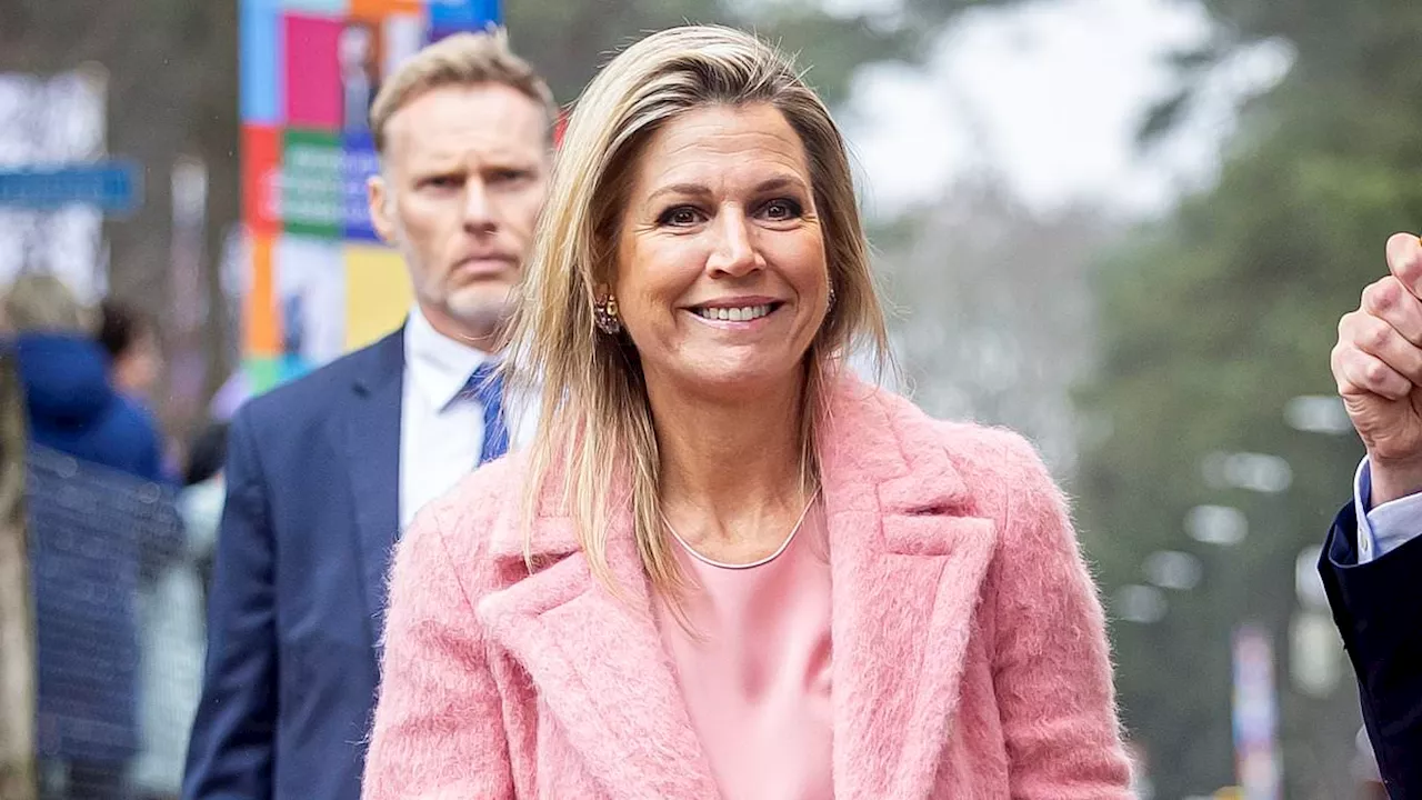 Queen Maxima of the Netherlands steps out in an all pink ensemble as she attends financial health...