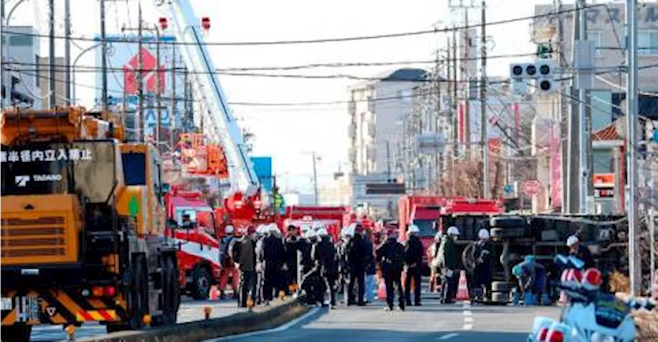 Sinkhole Rescue in Japan: Authorities Urge Water Conservation as Truck Driver Remains Trapped