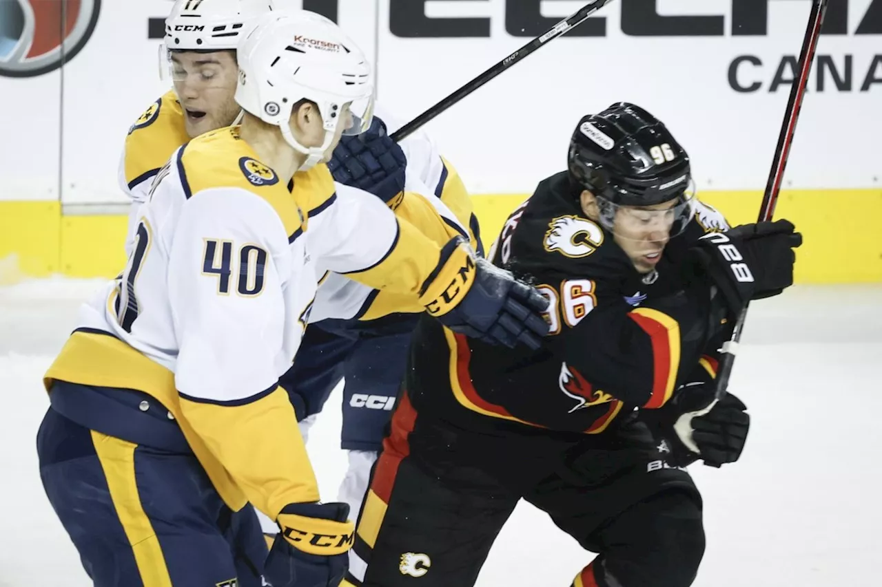 Kuzmenko's Penalties Doom Flames in Loss to Predators