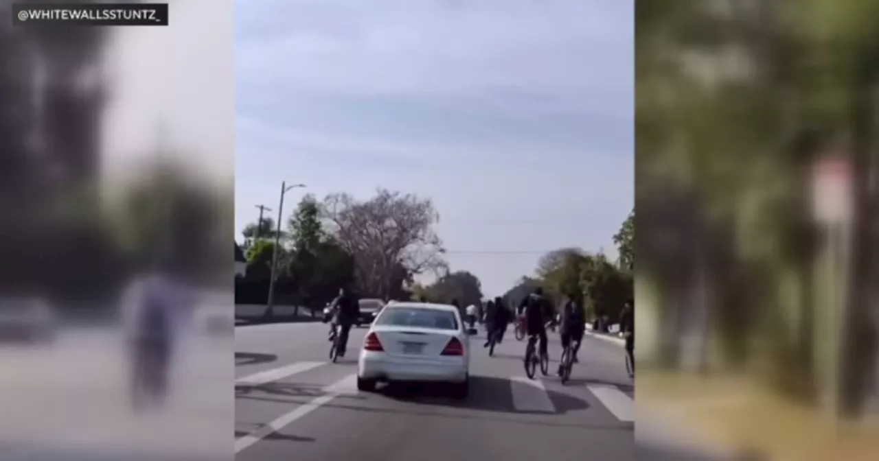 Video shows clash between group of teenage bicyclists and Mercedes-Benz in Mid-Wilshire