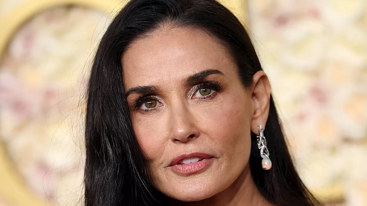 Demi Moore Stuns at 2025 Golden Globes in Gold Mermaid Gown