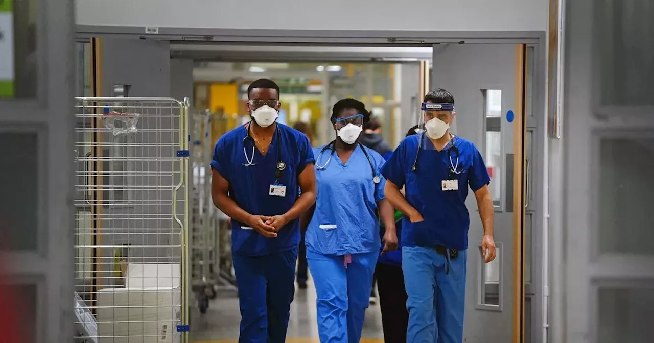 Face Masks Return to Greater Manchester Hospital Amid Virus Surge