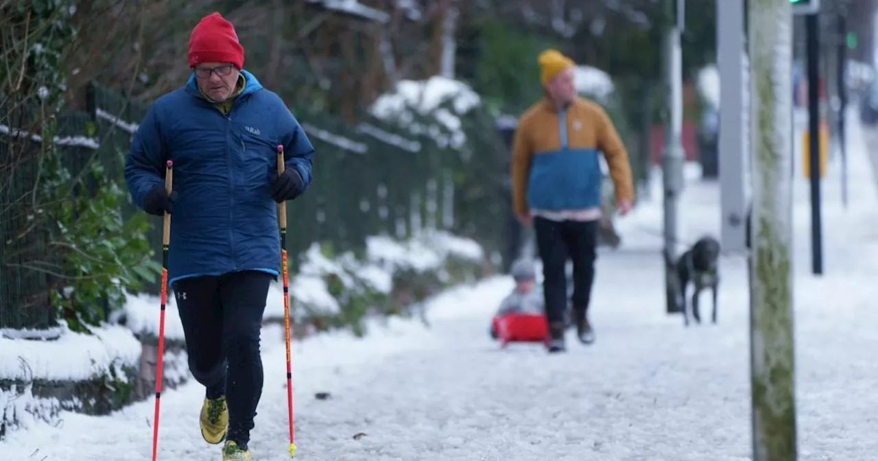 Heavy snow forces schools to close across UK, disrupting travel and daily life