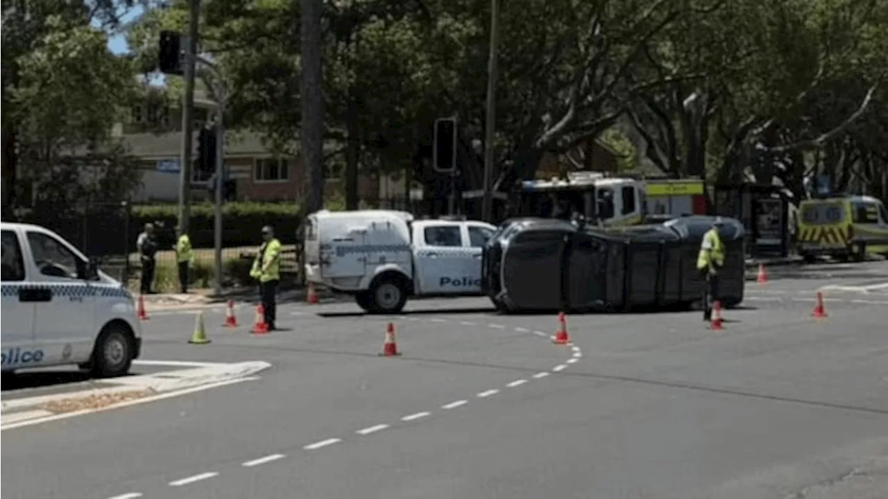 Car Flips After Collision with Police Vehicle in Sydney