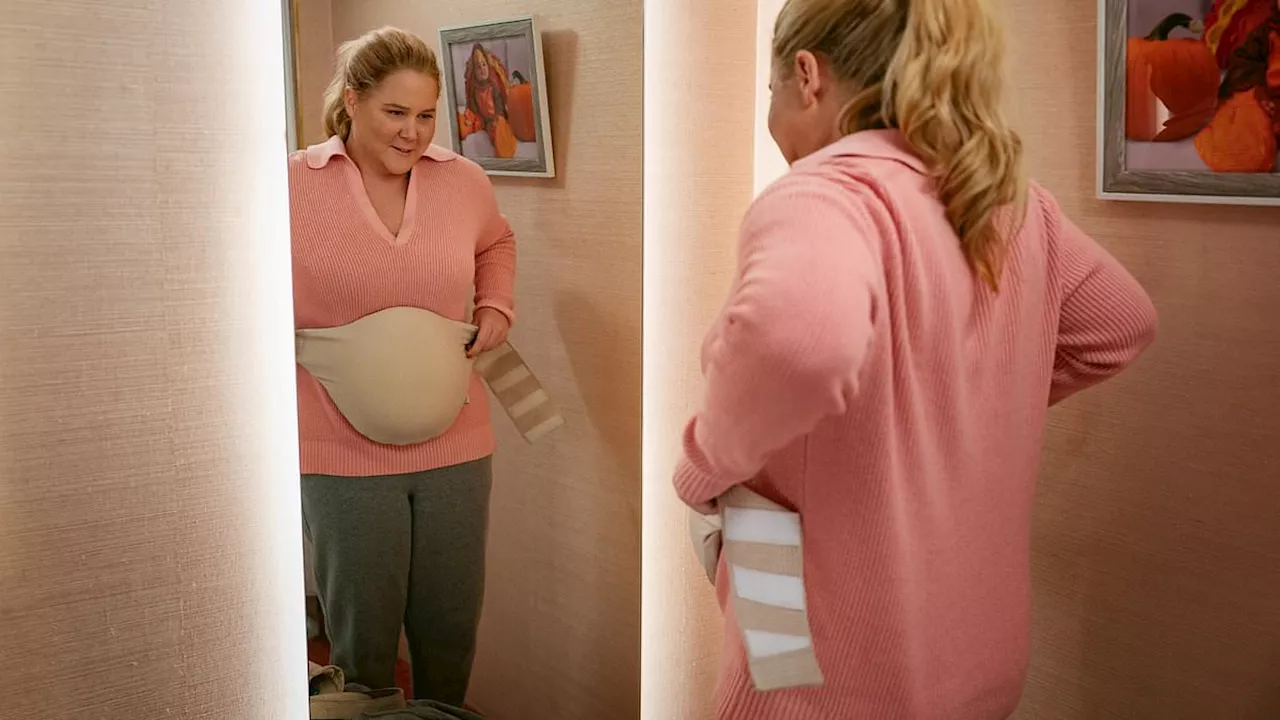 Amy Schumer's Kinda Pregnant trailer divides fans as she wears fake baby bump in Netflix comedy