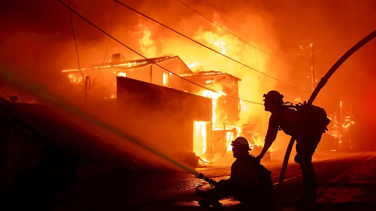 Two Wildfires Rage in Southern California, Forcing Thousands to Flee