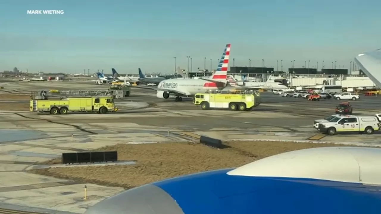 American Airlines Wing Clips United Airlines Tail at O'Hare Airport