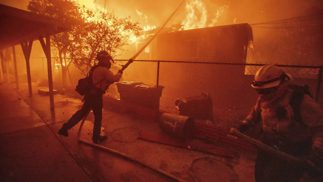 Wildfires Rage Across Los Angeles, Killing Two and Forcing Thousands to Flee