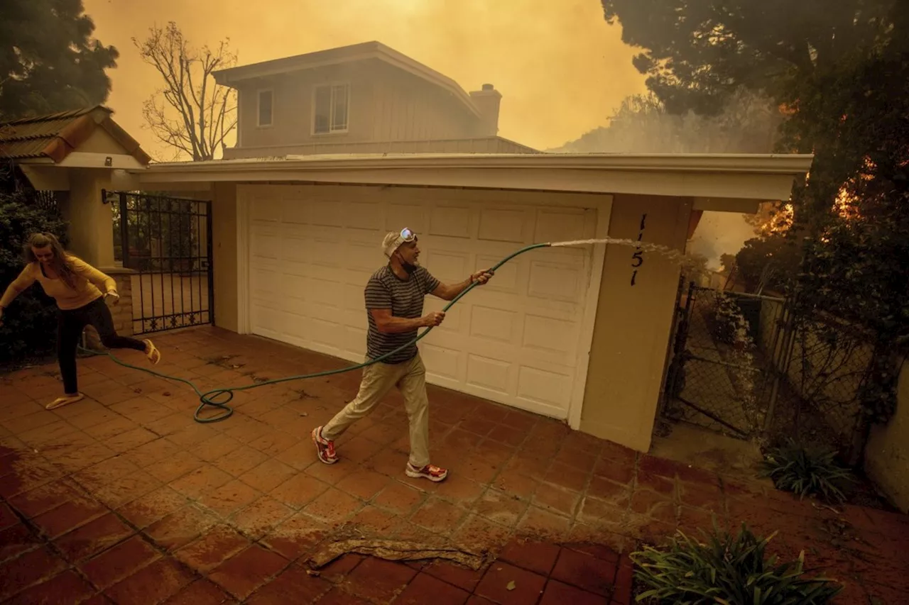 California governor says Pacific Palisades wildfire has destroyed many structures as winds kick up