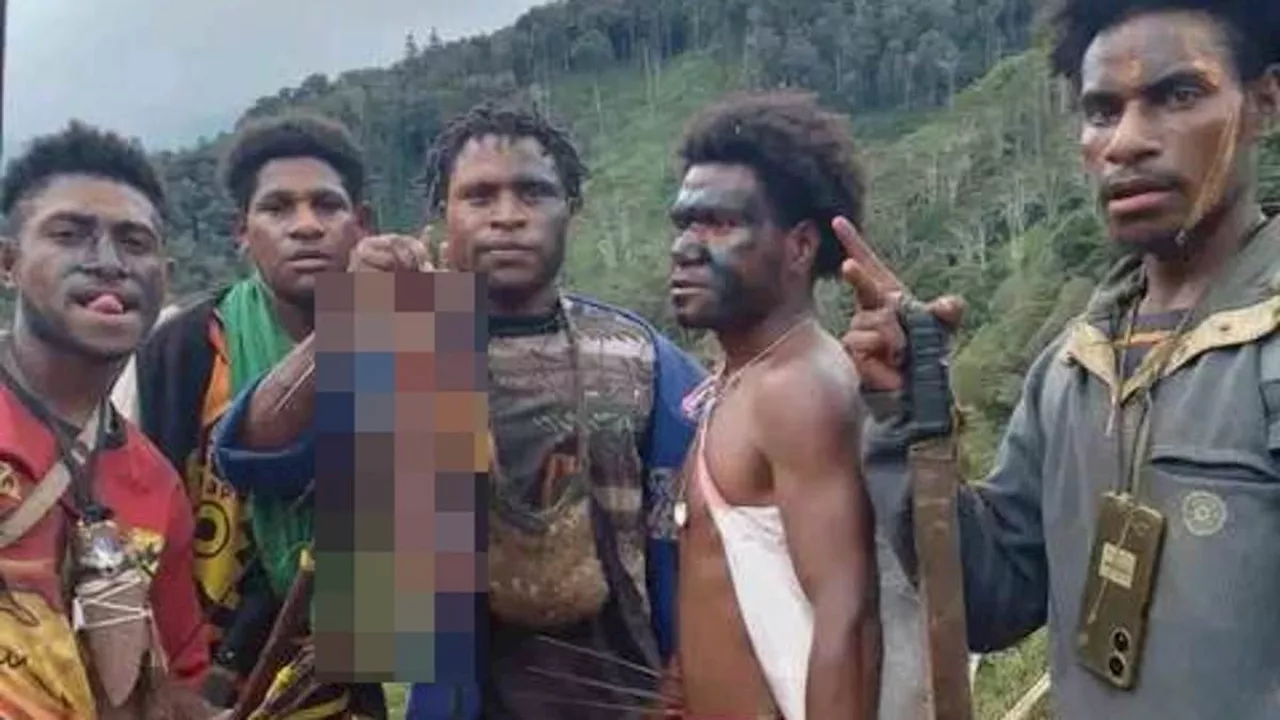 Cannibalism Horror in Papua New Guinea: Gang Poses with Severed Body Parts