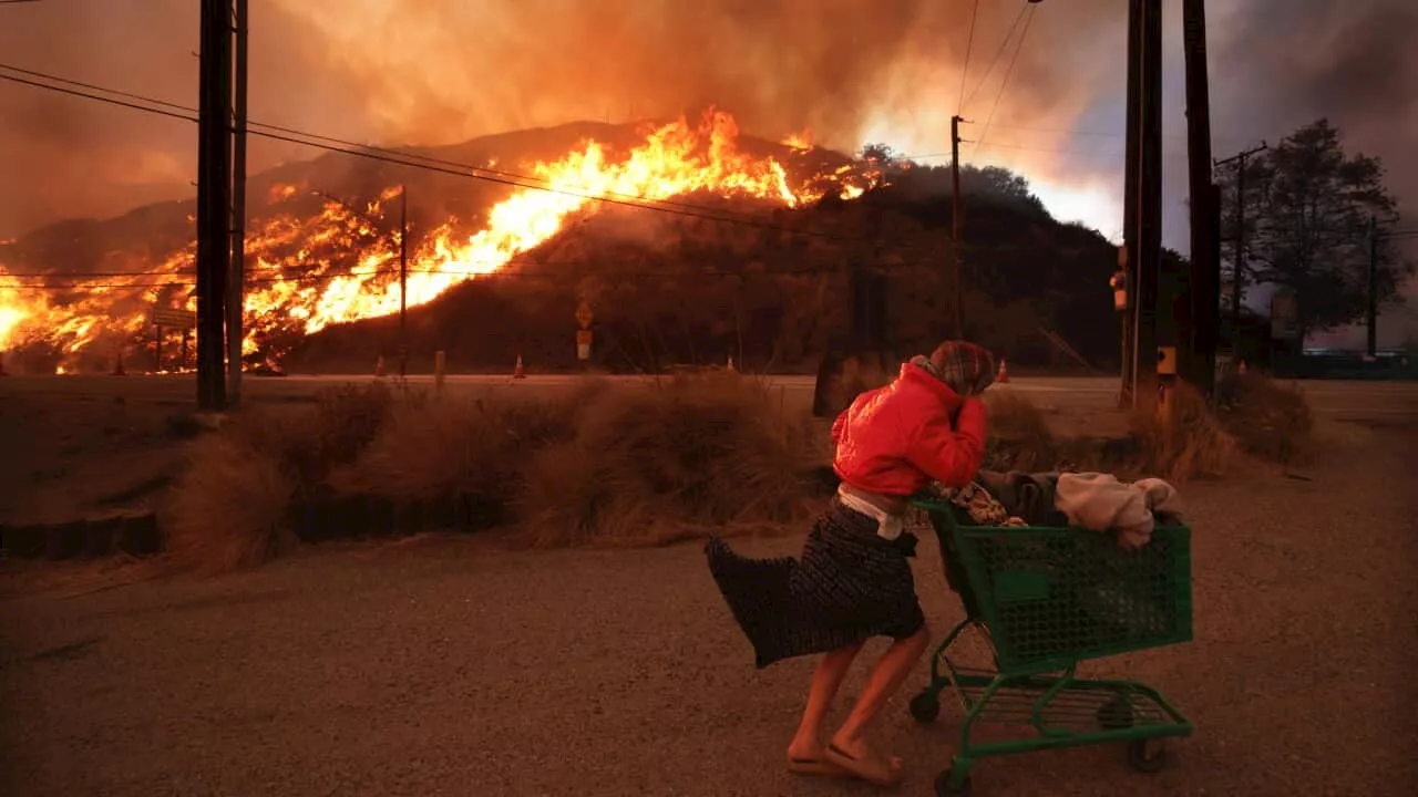 Wildfires Rage in Los Angeles, Displacing Thousands