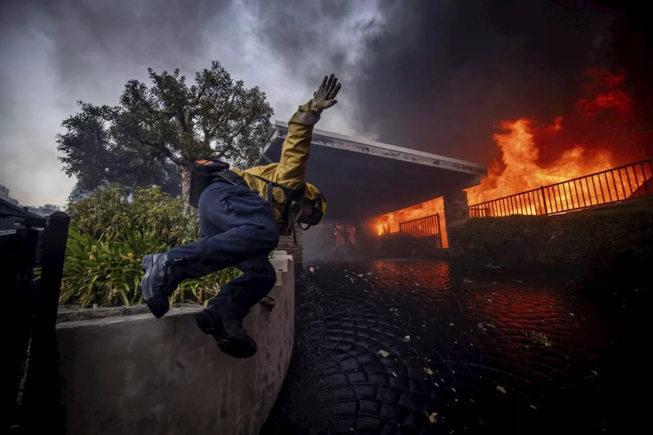 California governor says Pacific Palisades wildfire has destroyed many structures as winds kick up