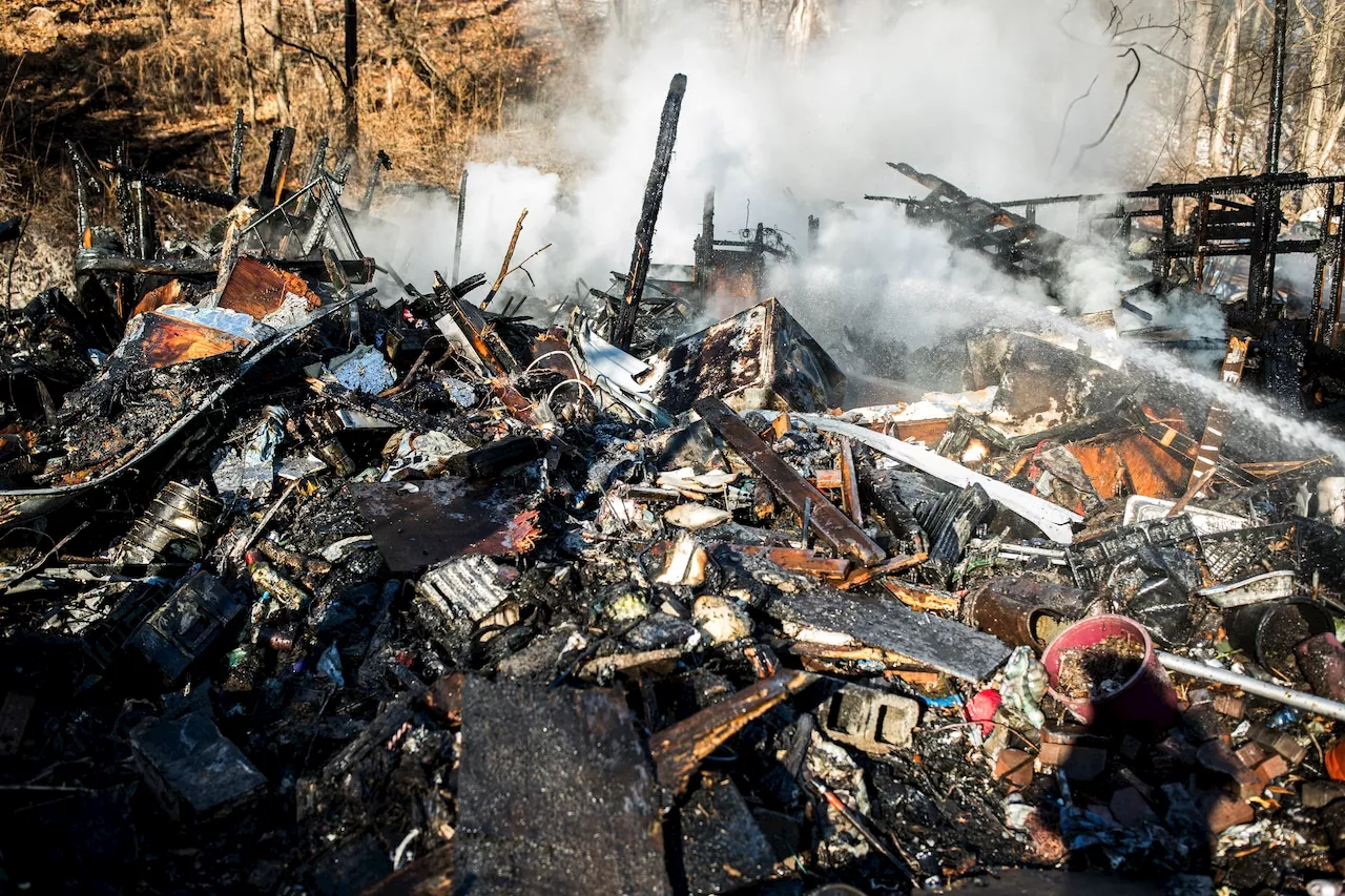 Neighbor who called 911 saw ‘red sparks’ coming from burning Dauphin County house where 2 died