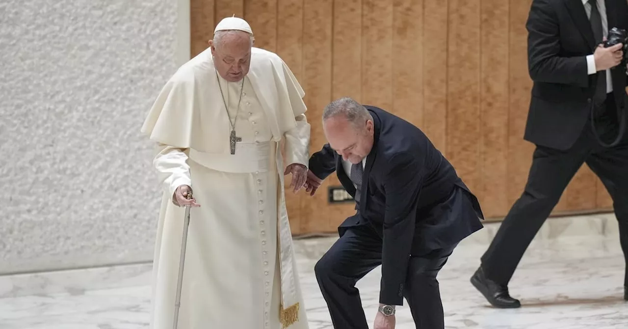 Pope Francis stumbles while walking into Jubilee audience at the Vatican as his walking stick snaps