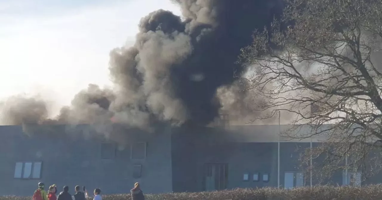 UK town hall engulfed in flames with smoke seen for miles