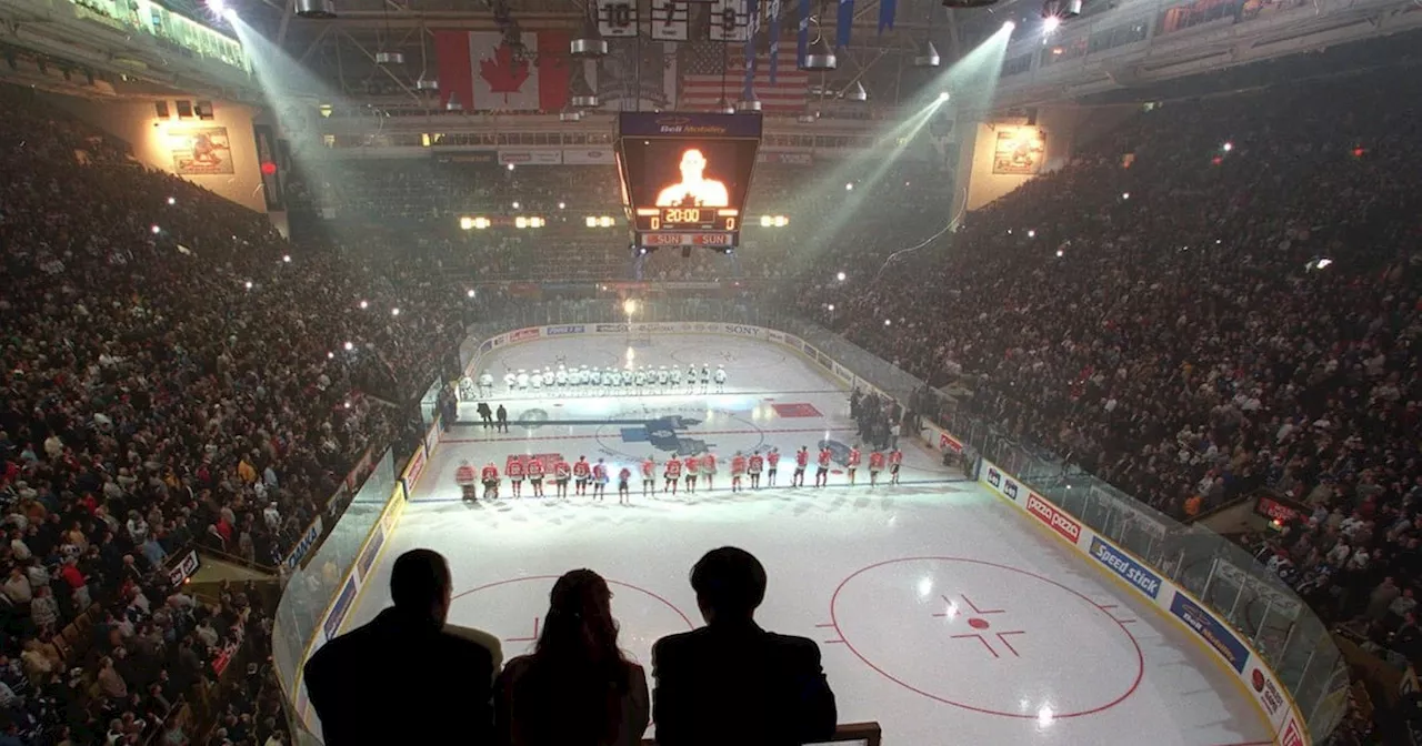 Three Ushers Watch as Blackhawks and Maple Leafs Players Line Up for National Anthems